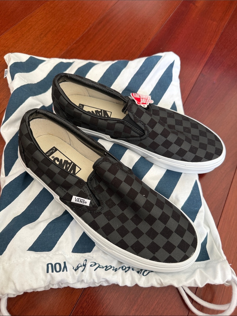 Vans Checkerboard Slip-On Sneakers in Black and Gray